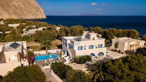 an aerial view of a house and the ocean at Stelios Place in Perissa