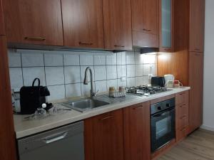 a kitchen with a sink and a stove at Lake Iseo Apartment - Taxo4 in Paratico +4 photos