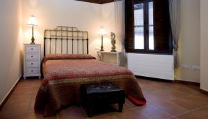 A bed or beds in a room at Rincón de San Cayetano