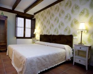 A bed or beds in a room at Rincón de San Cayetano