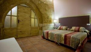 A bed or beds in a room at Rincón de San Cayetano