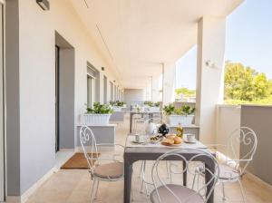 a dining room with chairs and a table at Dimora Anna - Exclusive Sea Loft in Bari