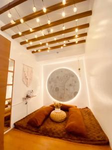 a room with a bed with a moon on the wall at Hiraya Luna in Manila +8 photos