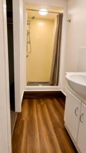 a bathroom with a sink and a shower at The Crossing Lodge in National Park