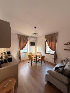 a living room with a couch and a table at Legend Suites Bitola in Bitola