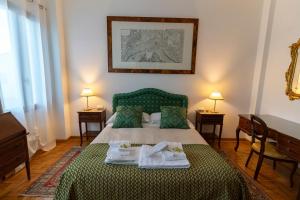 a bedroom with a bed with two towels on it at Locanda Confini in Dolo +45 photos