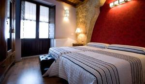 A bed or beds in a room at Rincón de San Cayetano