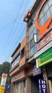 a building with signs on the side of it at BS Residency in Dehradun