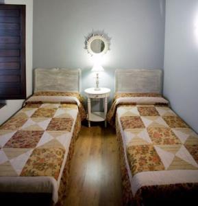A bed or beds in a room at Rincón de San Cayetano