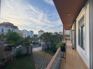a balcony of a house with a view of a street at Arden Reserve Villa in Binh Thai