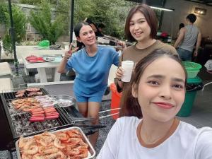 a group of girls standing next to a grill at Ma PoolVilla Khanom in Khanom