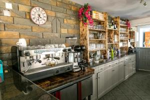 a kitchen with a coffee machine on a counter at Sigma Hotel in Paralia Vrachou