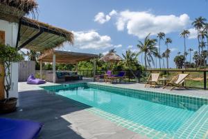 a pool at a villa with a view at Manao Seaview Pool Villa 33 - 5 Mins Walk To The Beach in Ko Lanta