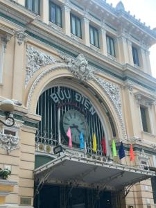 a building with a clock on the front of it at START HOUSE AIRPORT 5-MIN WALK Warm Stay, Easy Flight in Ho Chi Minh City