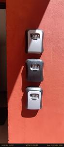 two black and white handles on a red wall at Il Gelsomino in Cantù