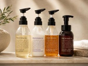 a group of four shampoo bottles sitting on a counter at Volcano in Kagoshima