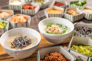 a table with bowls of food on a table at HOTEL MYSTAYS Nippori in Tokyo +17 photos
