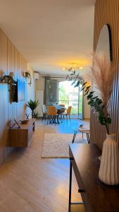 a living room with a table and a dining room at Riviera Heights Monaco in Beausoleil +12 photos