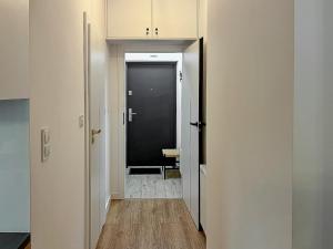 a hallway with a door leading to a room at Nowy Dwór Mazowiecki Chic Studio by BookingHost in Nowy Dwór Mazowiecki +17 photos