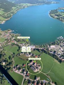 an aerial view of a park next to a lake at Ferienhof Mitterbauer in Mondsee