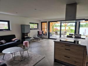 a living room with a couch and a table at Ferienhaus am Lanzer See in Lanze
