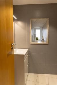 a bathroom with a sink and a mirror at Casa Saudade Vila Real North in Vila Real +20 photos
