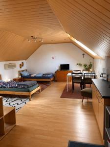 a living room with two beds and a table at Monteurzimmer-Graf in Nidda
