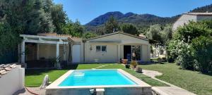 a house with a swimming pool in the yard at L'olivier TESSA Hôtesse suite 30m2 terrasse 20m2 in La Celle