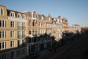a row of buildings on a city street at Hotel Sphinx in Amsterdam