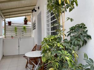 a balcony with a table and some plants at Milky house Vrachati in Vrachati