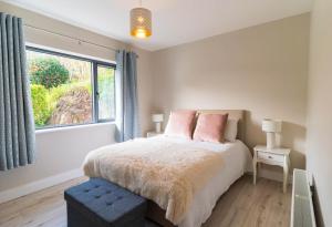 a bedroom with a bed and a window at Carhan House - Cahersiveen in Cahersiveen