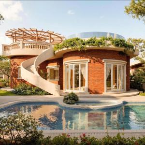 a brick house with a pool in front of it at QUEEN VILLA - Hoa Tiên paradise in Ðông Hội