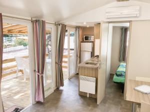 a small room with a kitchen and a sink at Greenchalets Roquebrune Sur Argens in Roquebrune-sur-Argens