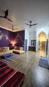 a large living room with two couches at The Travelers Nest Home Stay in Jhānsi