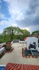 a motorcycle parked on the roof of a building at The Travelers Nest Home Stay in Jhānsi