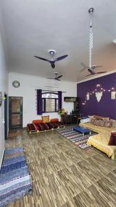a large living room with couches and a couch at The Travelers Nest Home Stay in Jhānsi