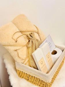 a basket with towels and pamphlets in it at Terracotta Azure in San Fernando +64 photos