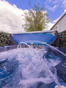 a pool of water with a boat in it at Sunset lodge 32 in West Thirston
