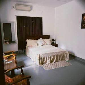 a bedroom with a large bed in a room at Melani Villa in Kandy