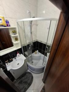 a bathroom with a shower and a sink at Apartman Jadran Private Parking in Dobrota +6 photos