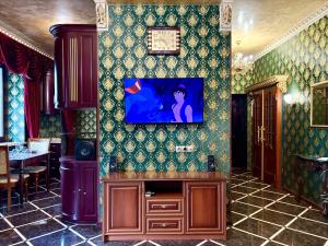 a room with a tv on a wall at Aladdin apartment in Kharkiv