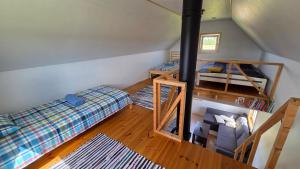 an overhead view of a room with two bunk beds at Peeduland Cabin in Kohatu