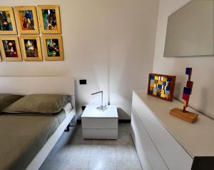 a bedroom with a bed and a side table at The Water Lodge in Omegna