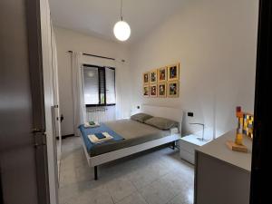 a small bedroom with a bed and a window at The Water Lodge in Omegna