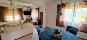 a living room with a couch and a table at Vivenda Do Relaxo '' Relax Villa " in Freiria