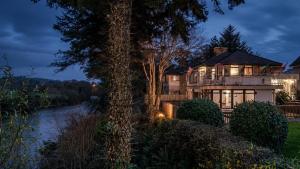 a house with a river in front of it at Killarney View House B&B in Killarney