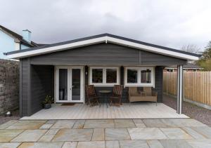 a pavilion with a table and chairs on a patio at Wildwood Haven - Killorglin in Killorglin