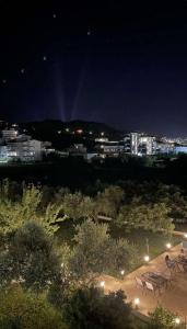 a group of chairs sitting in a park at night at Sunrise Apart-Hotel in Ulcinj +96 photos