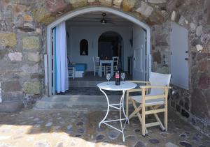 a table and chairs sitting on a patio at Salty Splash in Klima +12 photos