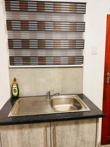 a sink in a kitchen with a window at MandA Cozy GuestHouse in Middelburg +20 photos